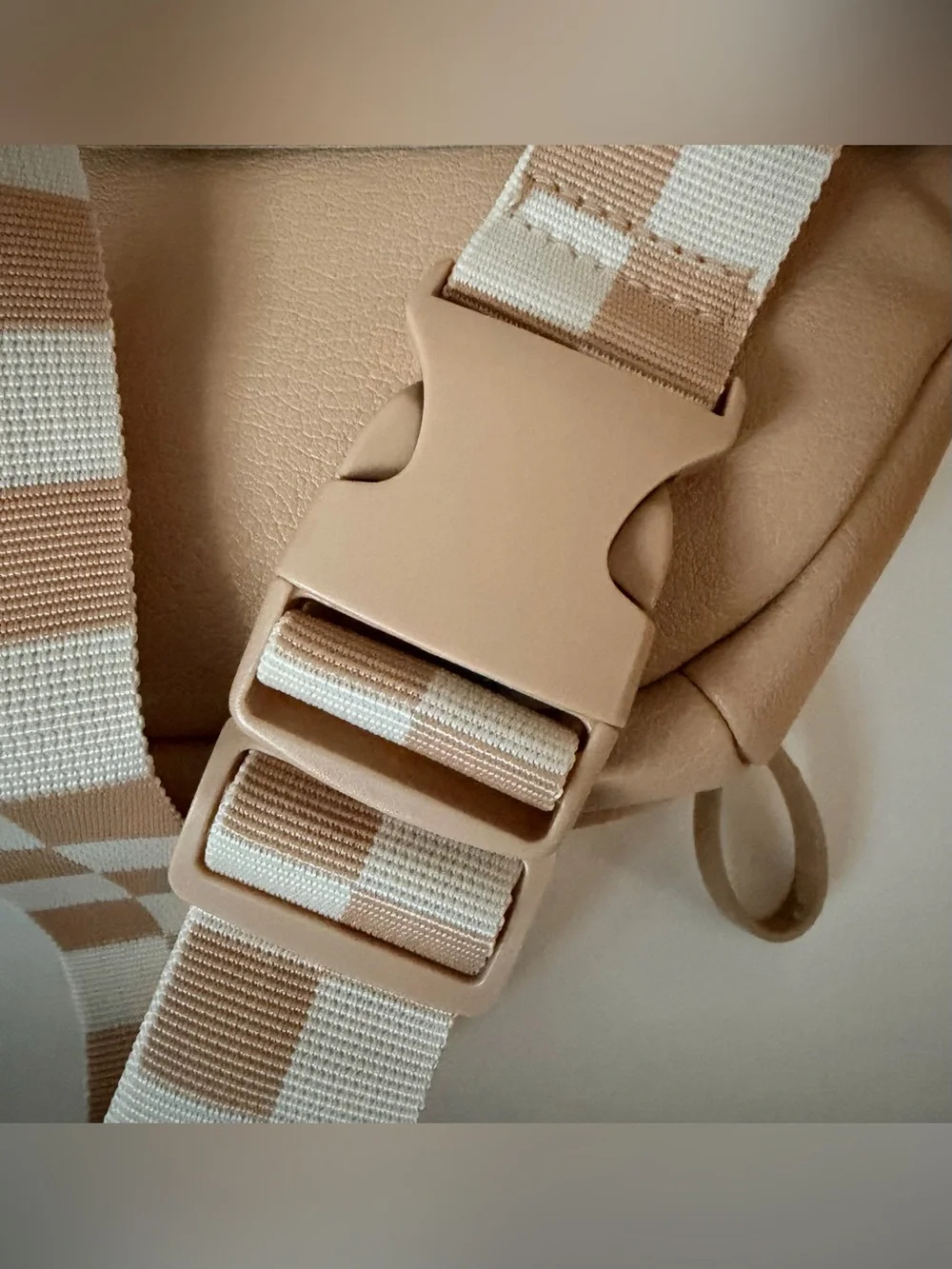 Cloud Island diaper sling in tan with checkered strap